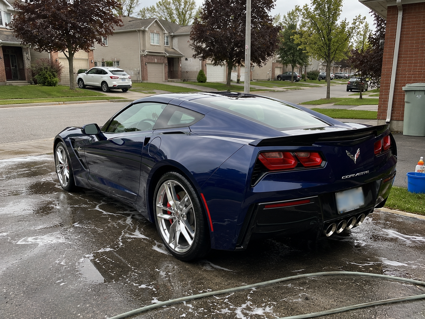 Blue Chevrolet Corvette Stingray washed and detailed in a Mississauga driveway